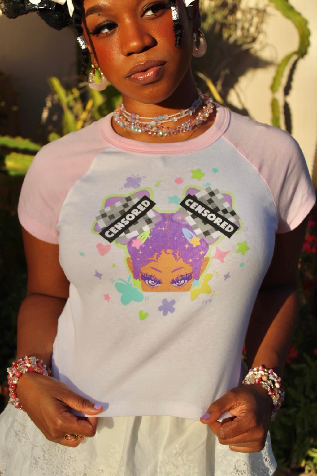 Close-up of the CENSORED tee with pink sleeves